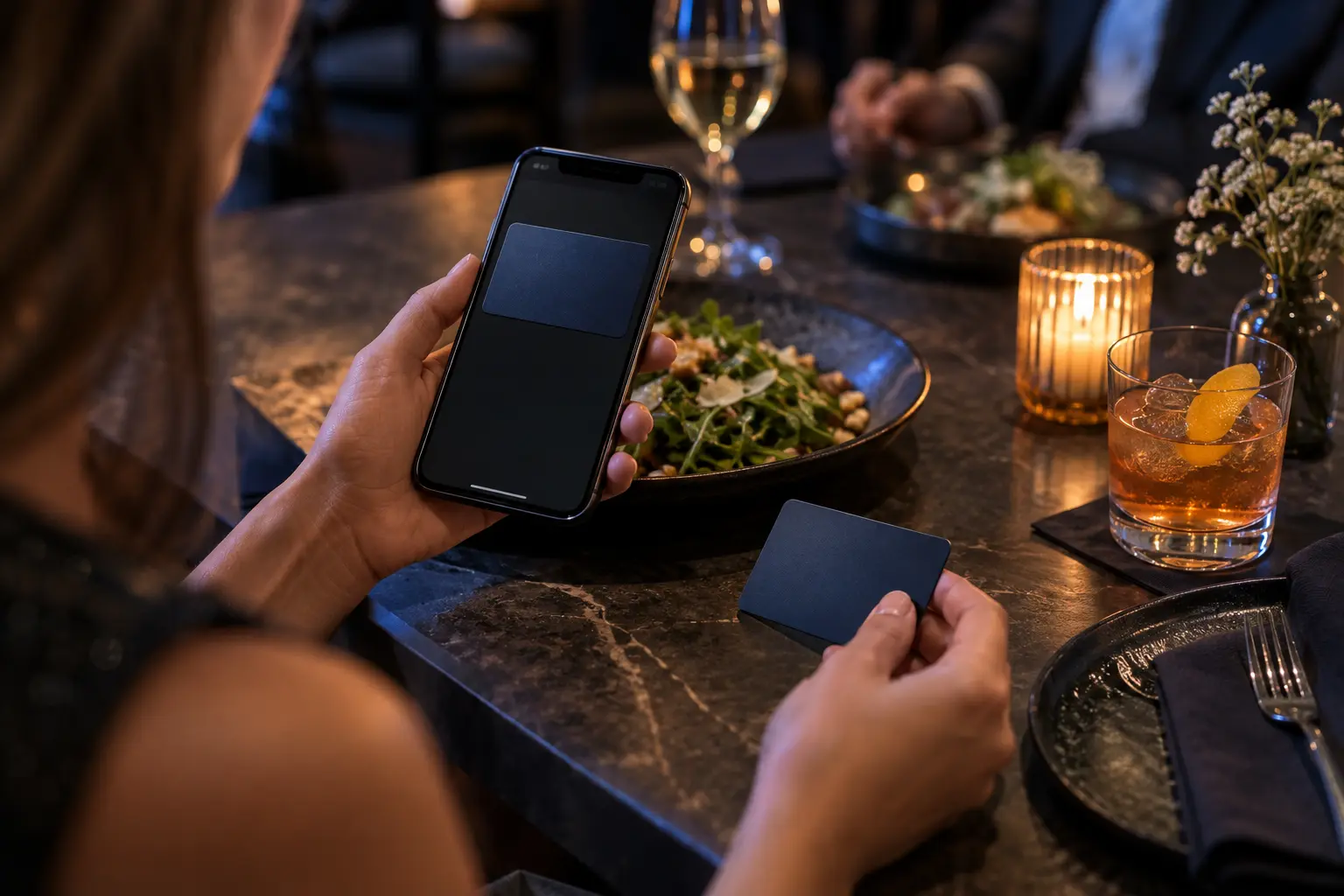 A phone wallet card beside a physical gift card